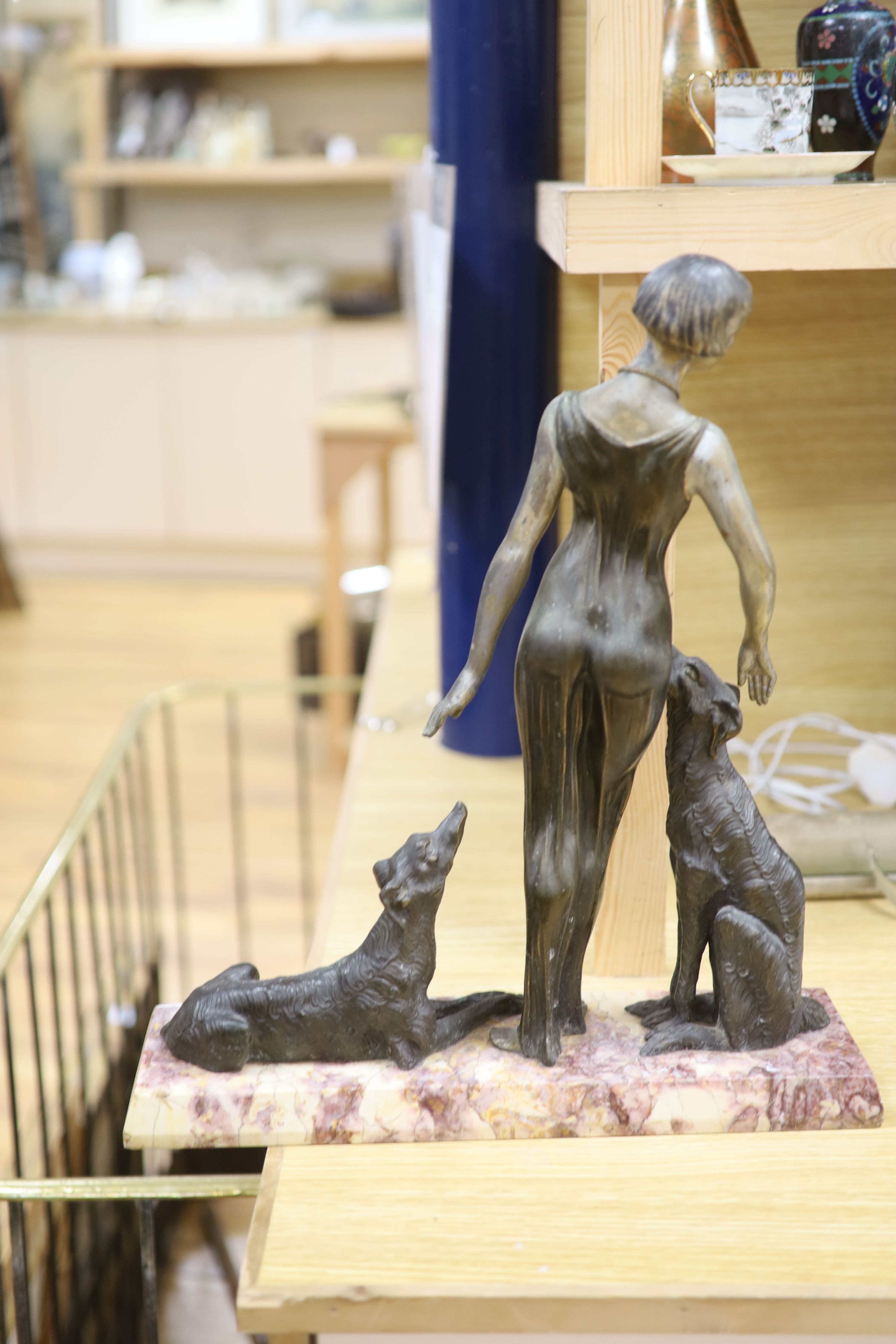 A Spelter Art Deco figure of a dog and borzoi, on a marble base, height 45cm